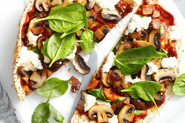 Mushroom, bacon, caramelised onion and spinach pizza