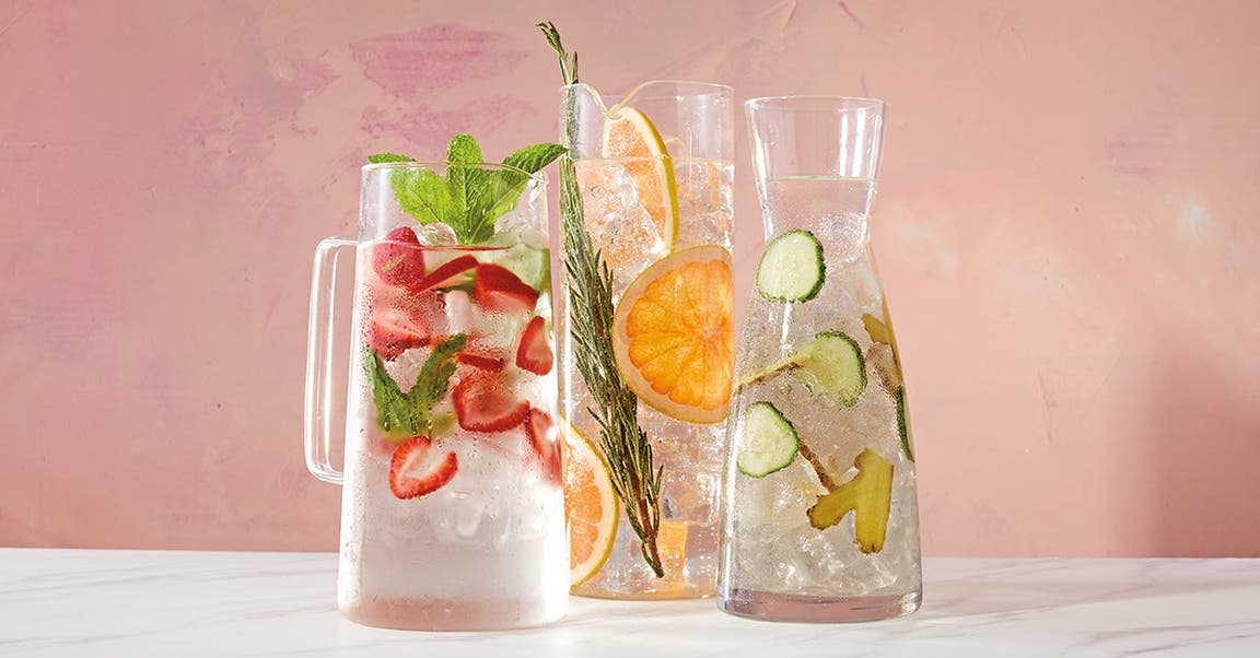 Pitchers of water with different fruits
