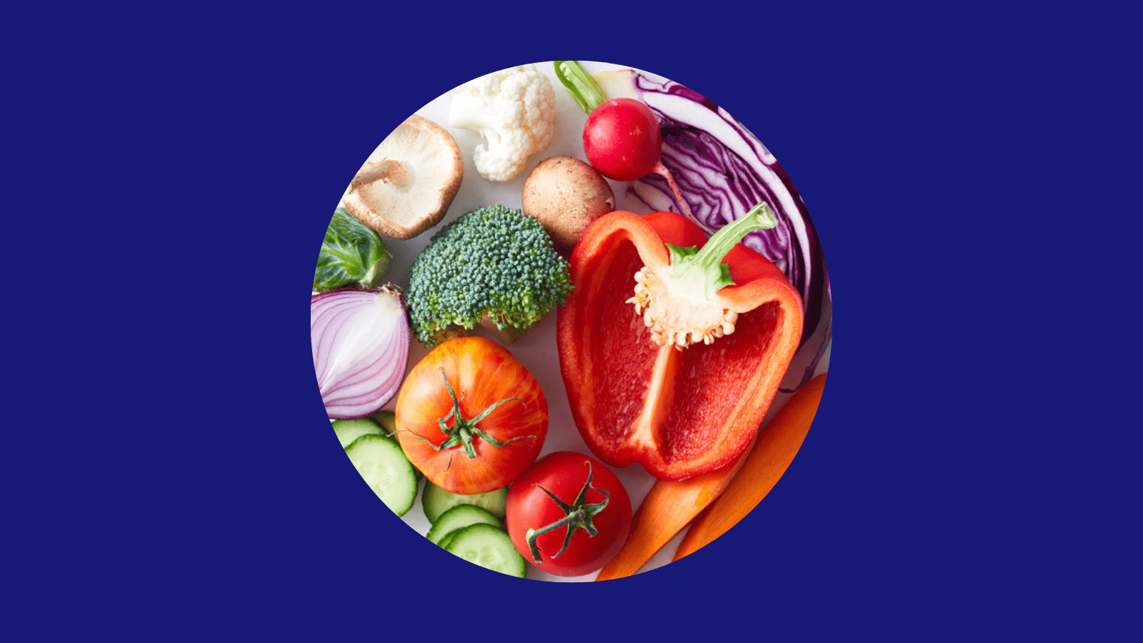 A variety of fresh vegetables including red bell pepper, broccoli, tomato, cucumber, mushrooms, and red onion arranged in a circle on a blue background.