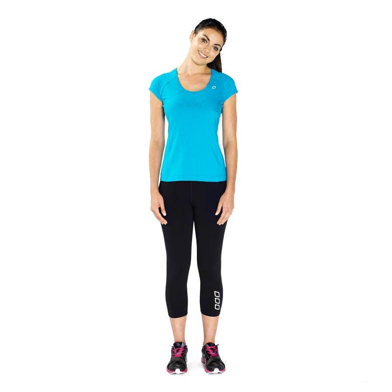 Woman performing ear to shoulder stretch for neck flexibility.