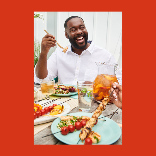 WW Member Tim enjoying a plated meal with others