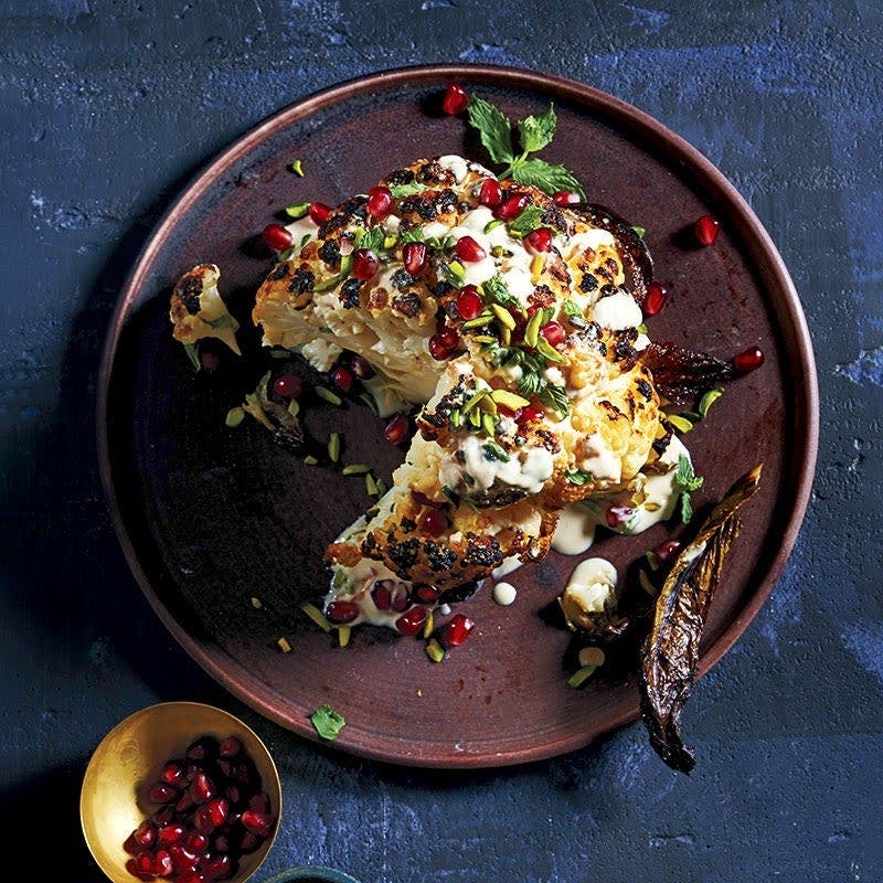 Whole Roasted Cauliflower with Tahini, Mint, Pistachios and Pomegranate Seeds