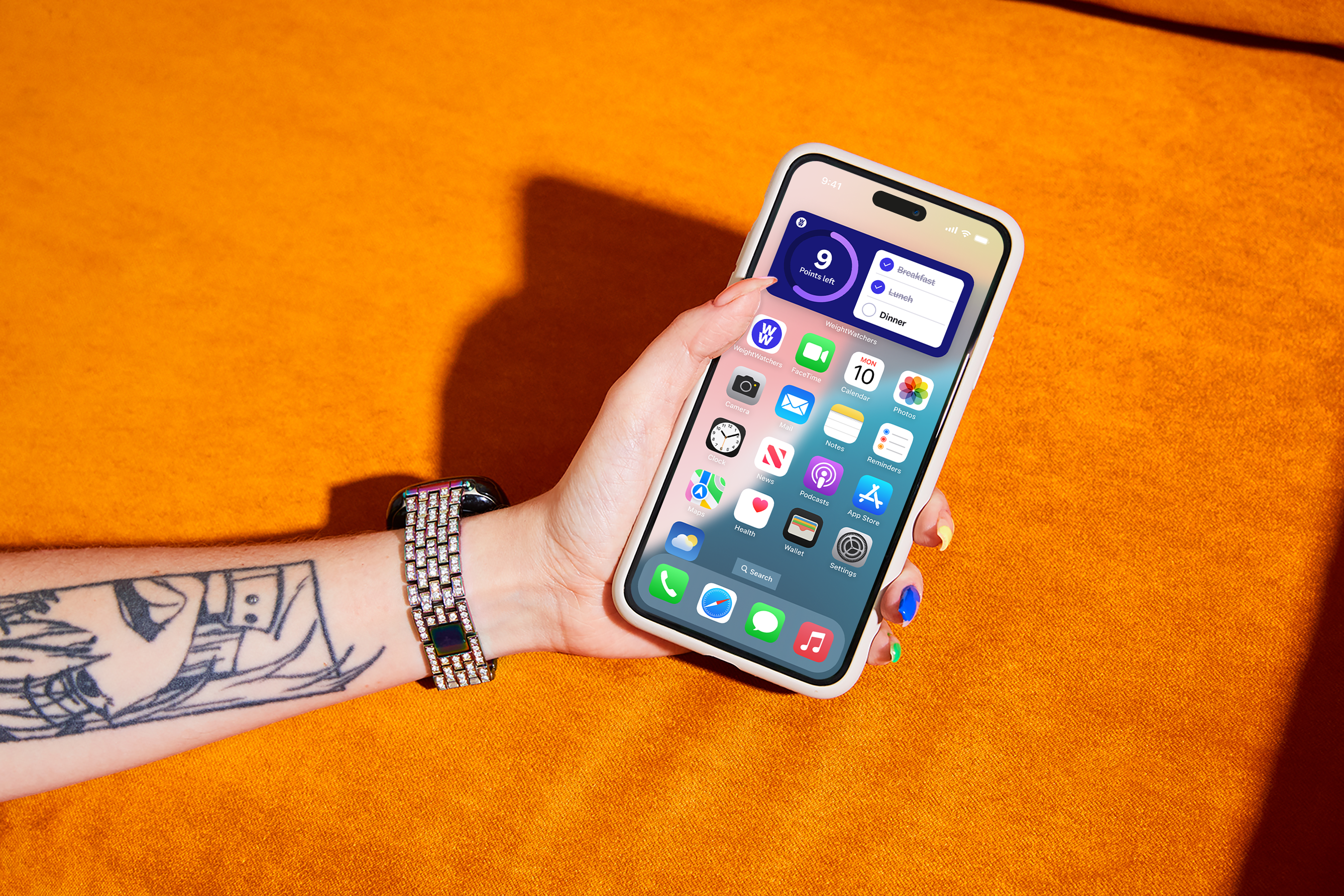 A person holds an iPhone, showcasing a blend of technology and personal expression.