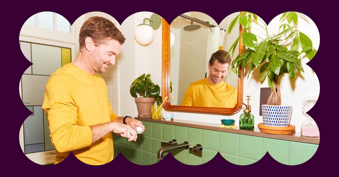 A man brushes his teeth