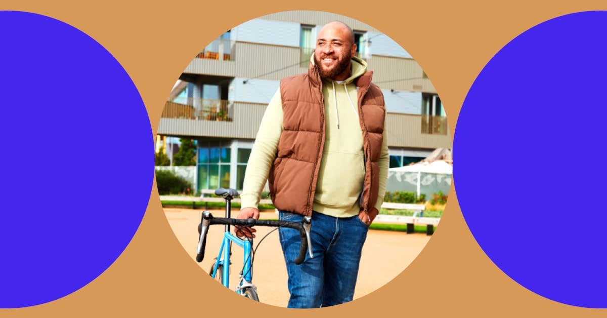 A man stands next to his bike