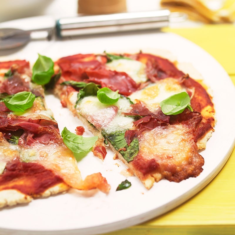 Gluten-free spinach and Parma ham pizza