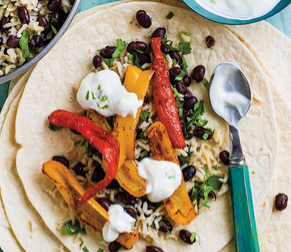Roasted pepper burritos with black beans, rice and lime yoghurt