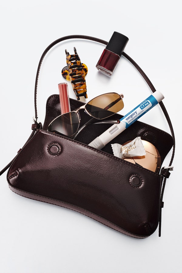 injectable weight-loss medication pen in purse