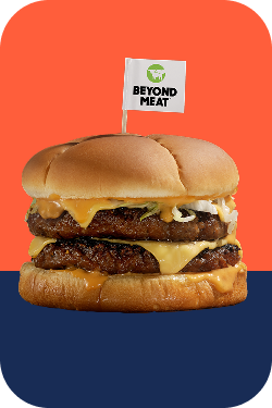 Beyond Beef patties on a cheeseburger