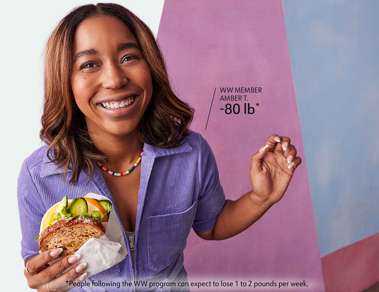 WW member Amber T. eats a sandwich. She has lost 80 pounds. People following the WW program can expect to lose 1 to 2 pounds per week.