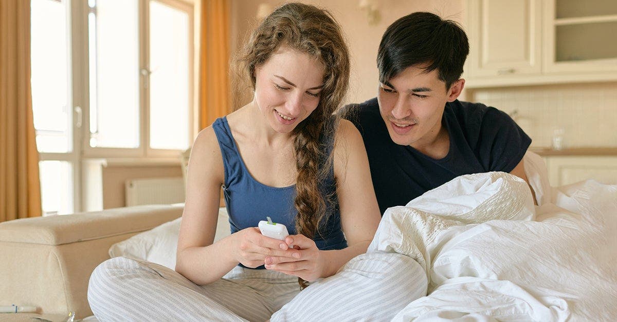 couple looking at diabetes tracker