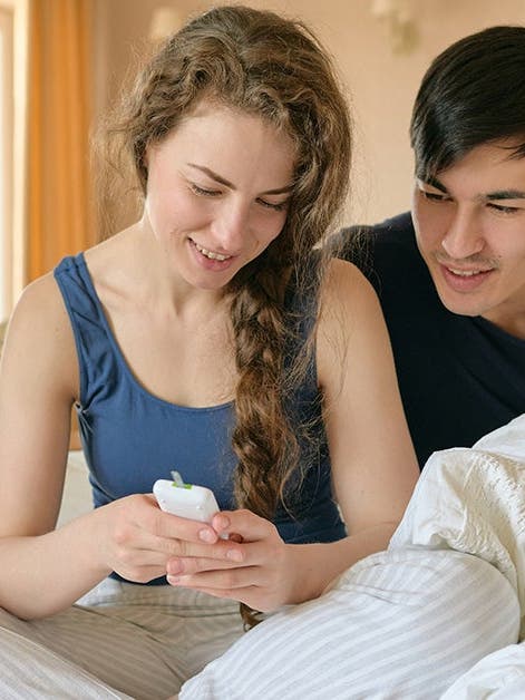 couple looking at diabetes tracker
