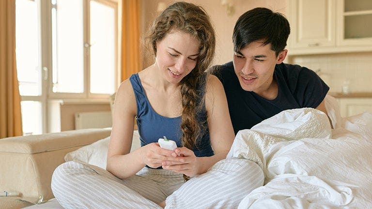 couple looking at diabetes tracker