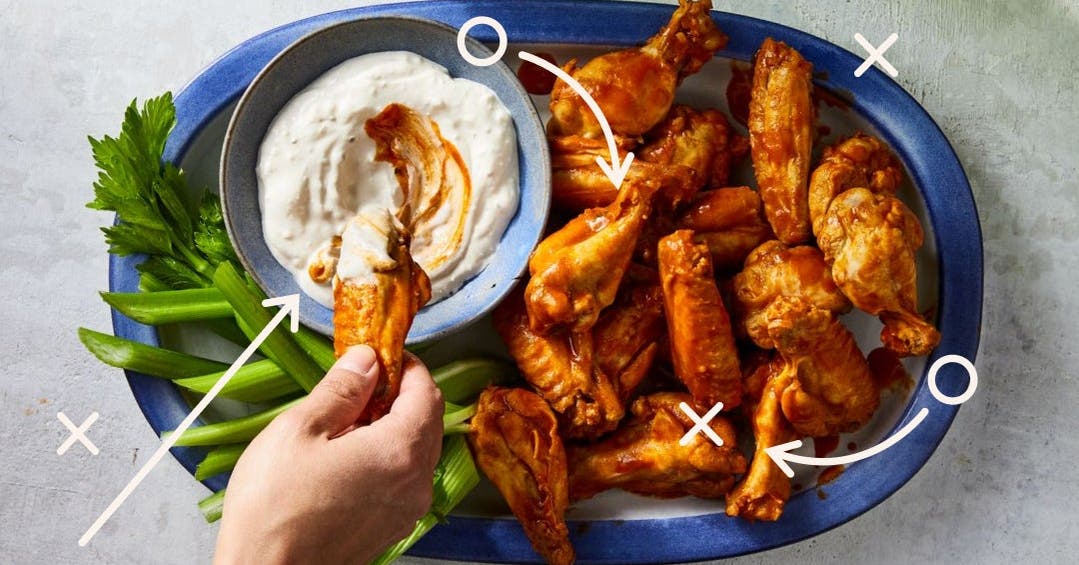 chicken wings dipped in ranch dressing