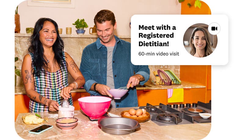 A woman and man cooking and smiling featuring a registered dietitian app screen