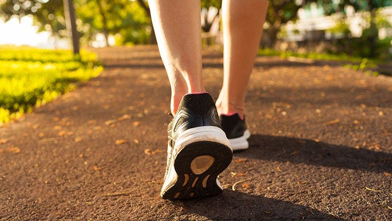 person going for a jog wearing sneakers