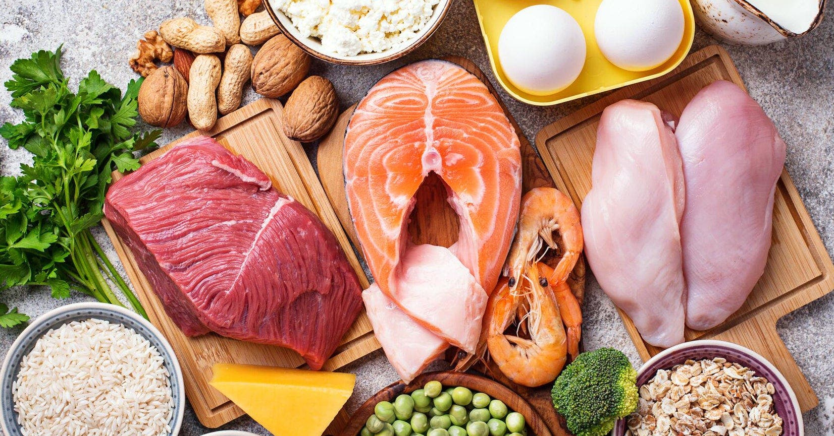 An assortment of nutritious foods beneficial for heart health, featuring colorful fruits, leafy greens, and whole grains.