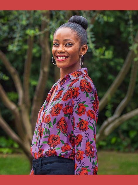 WW Member Alisia M. standing in front of a tree smiling