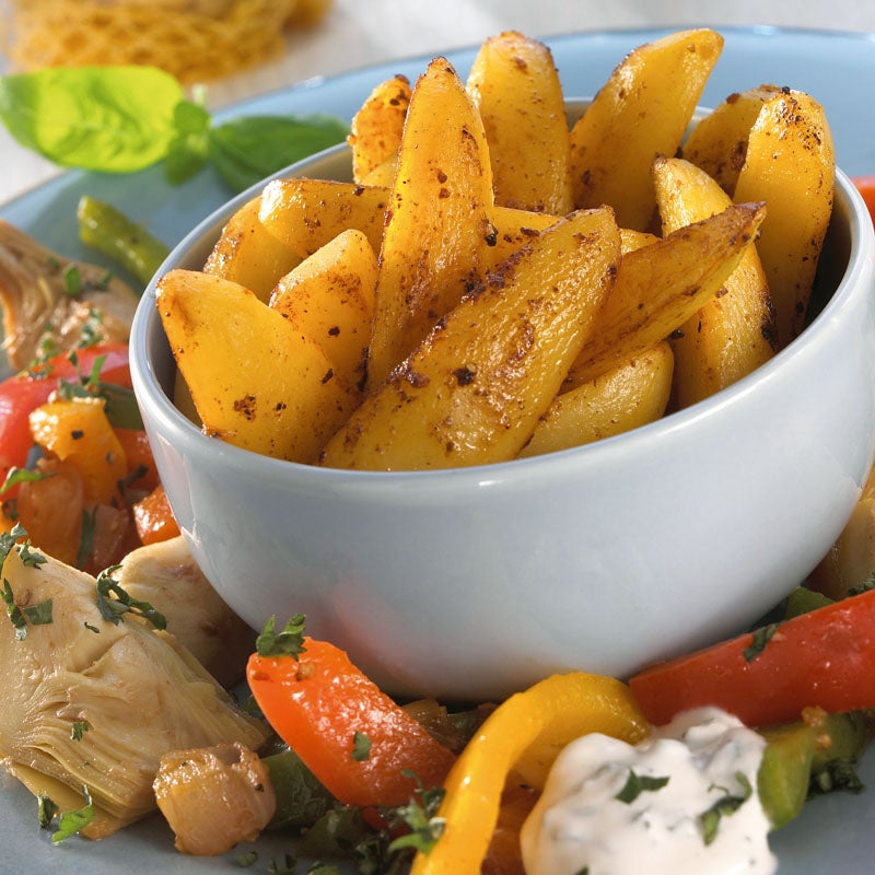 Kartoffelspalten mit Artischocken-Paprika-Gemüse Rezept | WW Deutschland Kartoffelspalten mit Artischocken-Paprika-Gemüse Rezept | WW Deutschland