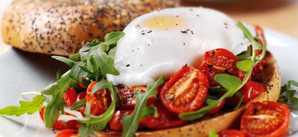 Oven roasted tomato, egg and rocket bagel