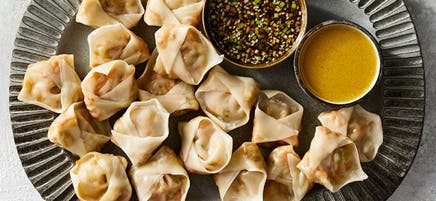 Steamed vegetable dumplings with two dipping sauces
