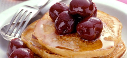 Oatmeal-buttermilk pancakes topped with cherries
