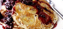 Whole-grain banana pancakes with blackberry syrup
