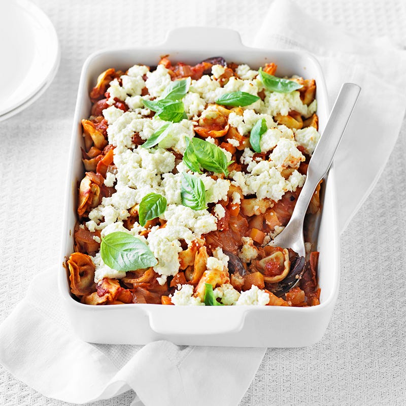 Baked tortellini with tomato, olives and ricotta