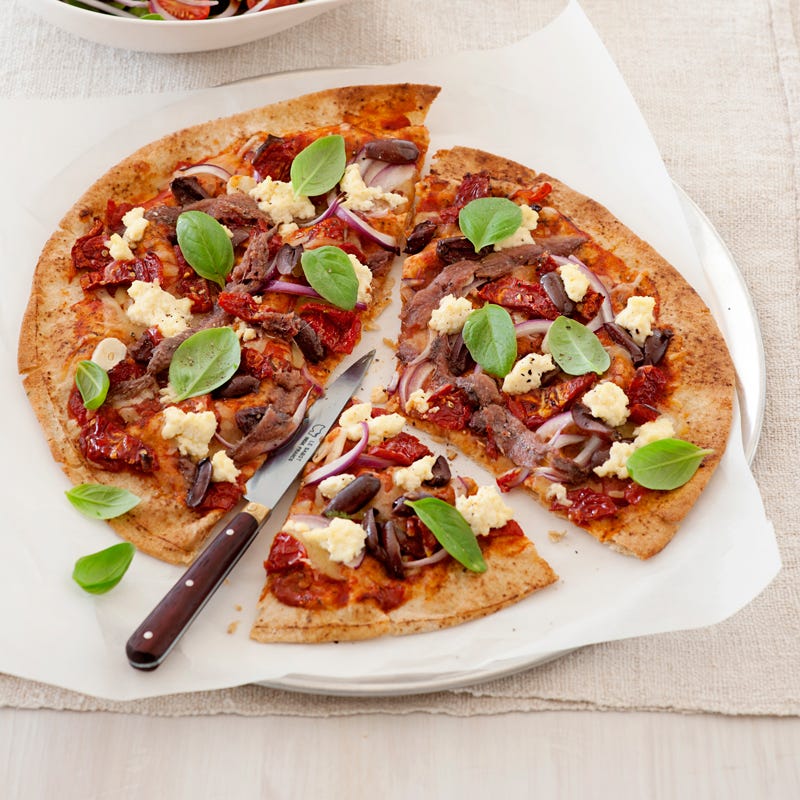 Photo of Wholemeal pizza with anchovies, olives and sundried tomatoes by WW