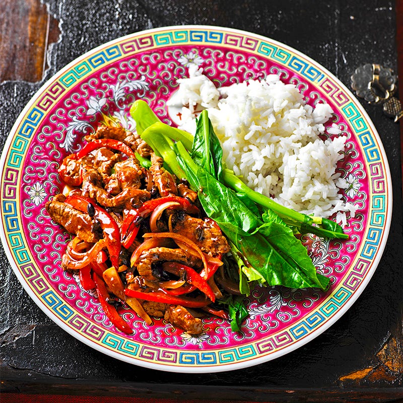 Beef in black bean sauce with rice and greens