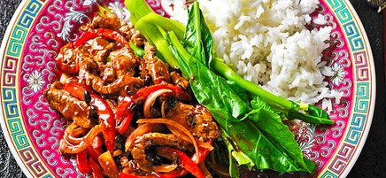 Beef in black bean sauce with rice and greens