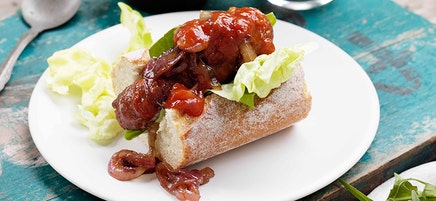 Gourmet sausage roll with onions and relish