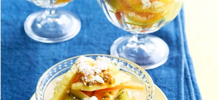 Layered tropical fruit salad with coconut macaroons