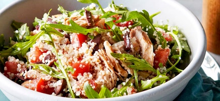 Couscous salad with tuna, tomatoes, olives and rocket