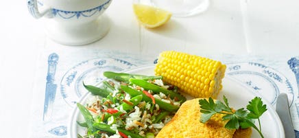 Polenta-coated pork schnitzels with rice salad