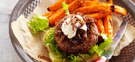 Beef burger with balsamic caramelised onions and sweet potato fries