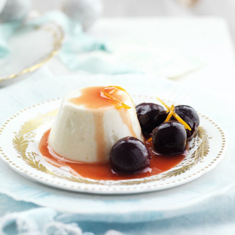 Orange scented panna cotta with poached cherries