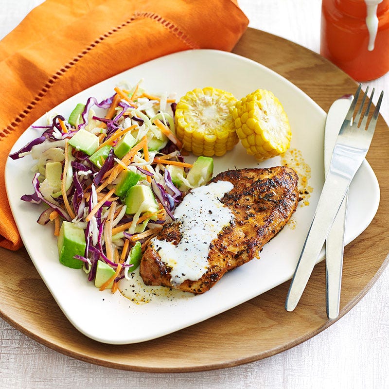 Cajun chicken with avocado coleslaw and corn