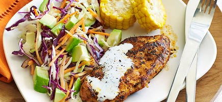 Cajun chicken with avocado coleslaw and corn