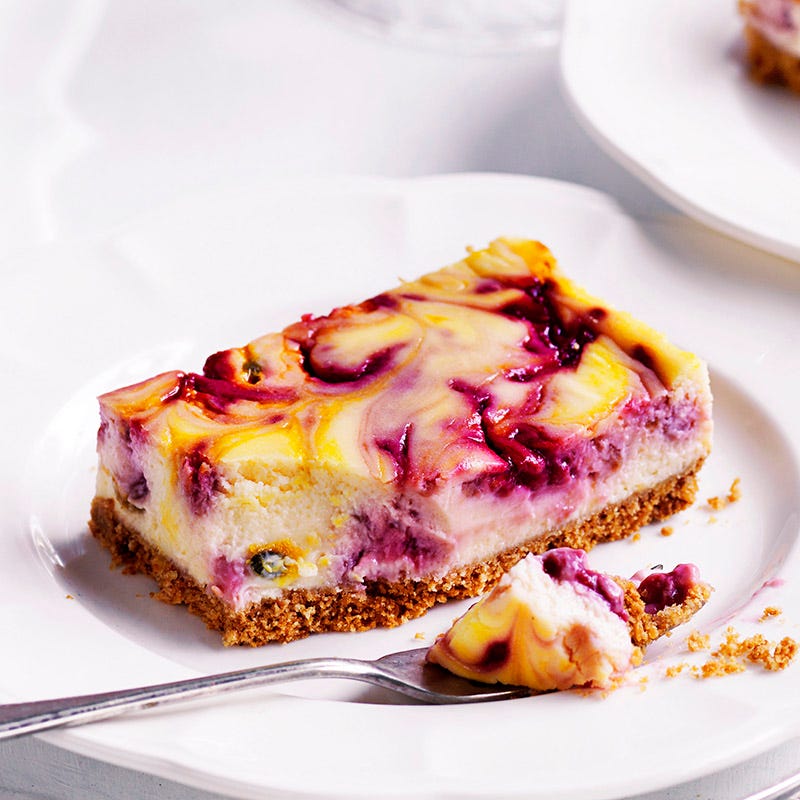 Photo of Raspberry and passionfruit ripple cheesecake slice by WW