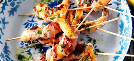 Prawn and bacon skewers with herb dressing