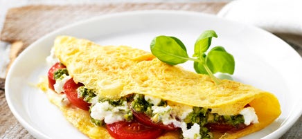 Tomato, pesto and two-cheese omelette