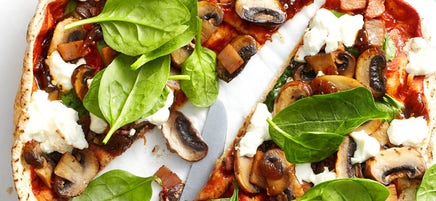Mushroom, bacon, caramelised onion and spinach pizza