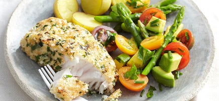 Quinoa-crumbed fish with tomato and avocado salad