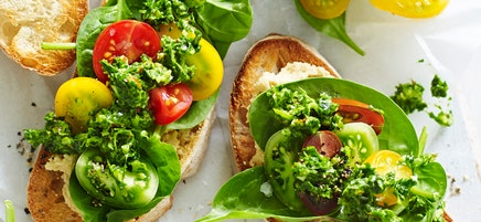 Open tomato sandwich with almond basil pesto