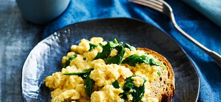 Spinach and corn scrambled eggs on rye