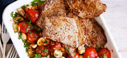 Veal steaks with braised mushrooms and cherry tomatoes