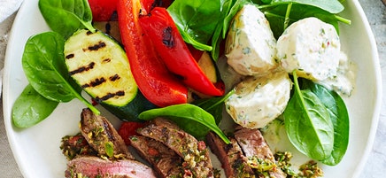 Chimichurri steaks with potato salad and chargrilled vegetables