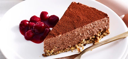 Chocolate cheesecake with cherry sauce