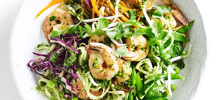 Warm noodle salad with coriander pesto and prawns